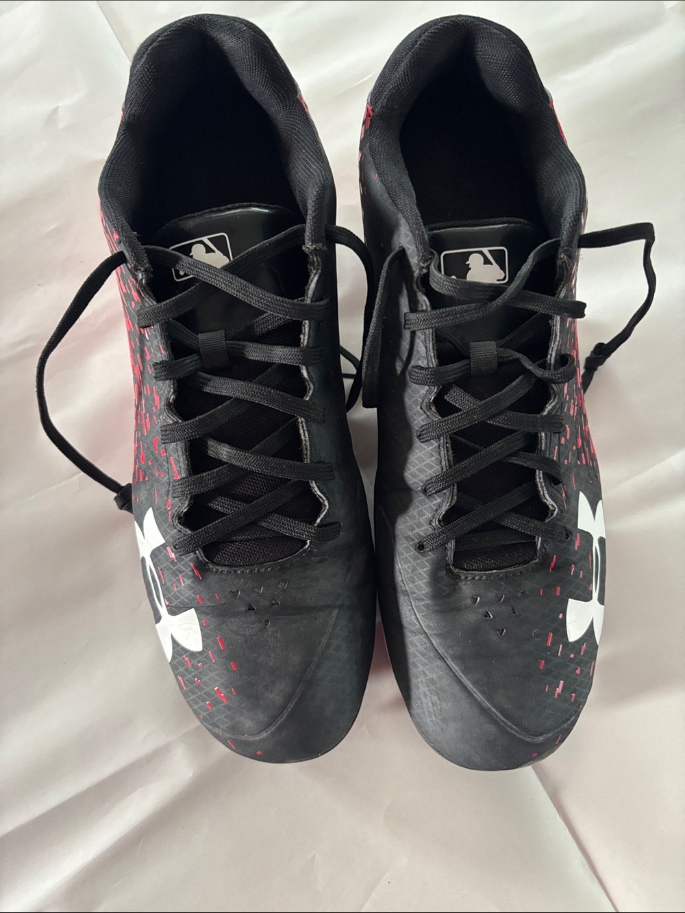 Under Armour Black Cleats with red Accents and White Logo
size 13